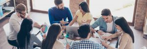 people sat around a desk discussing decision bias
